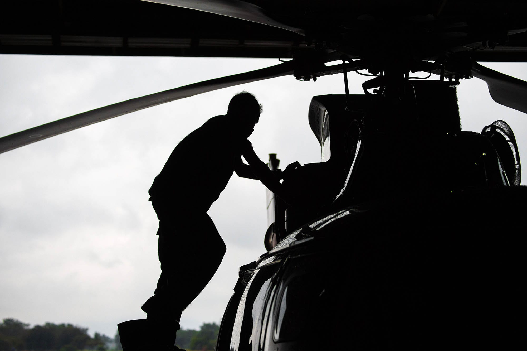 Man working on a helicopter